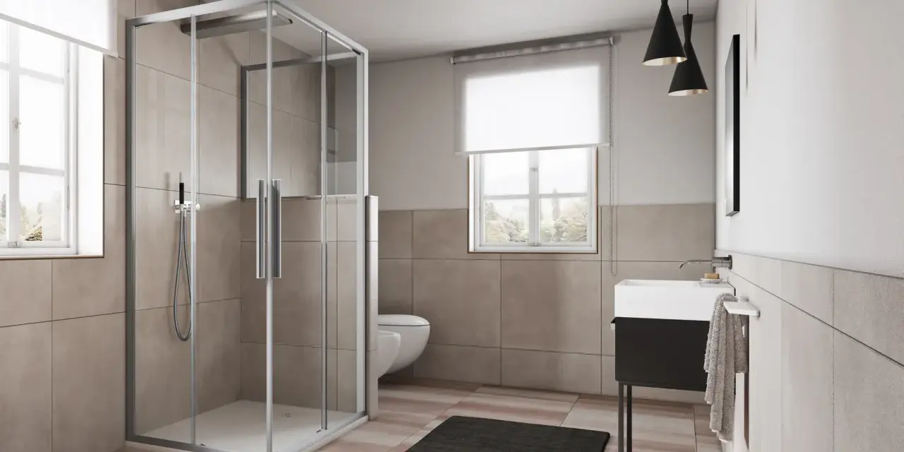 Box doccia angolare moderno con ante scorrevoli in vetro trasparente, che mostra le sue dimensioni ideali per un bagno spazioso.
