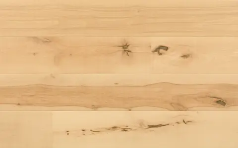 Superficie di parquet faggio naturale con venature evidenti e nodi che raccontano la storia del legno.
