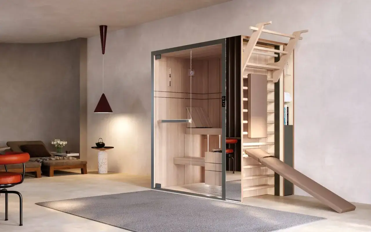 Sauna moderna con parete per arrampicata e scivolo, ideale per una rigenerante doccia dopo allenamento.